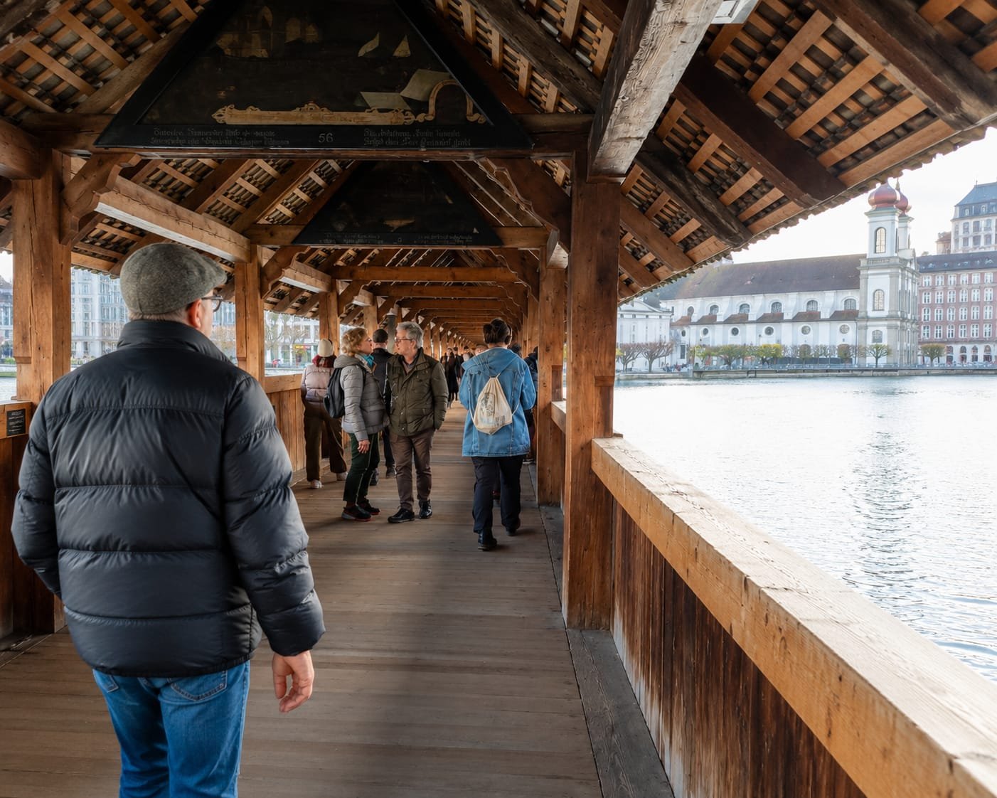 Historic Chapel Bridge Kapellbrücke in Lucerne Old Town with Jesuit Church and Reuss River