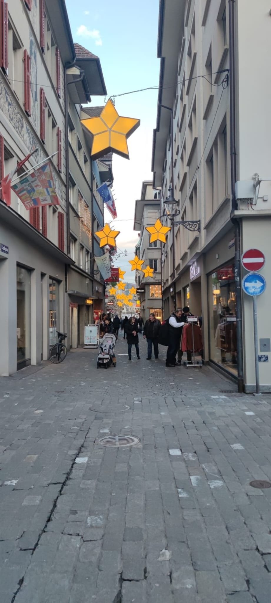Narrow cobblestone street in Lucerne Old Town with traditional Swiss architecture