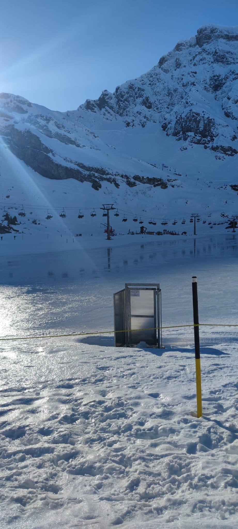 Mount Pilatus winter summit with ice rink, chairlift and jagged snowy peaks above Lucerne