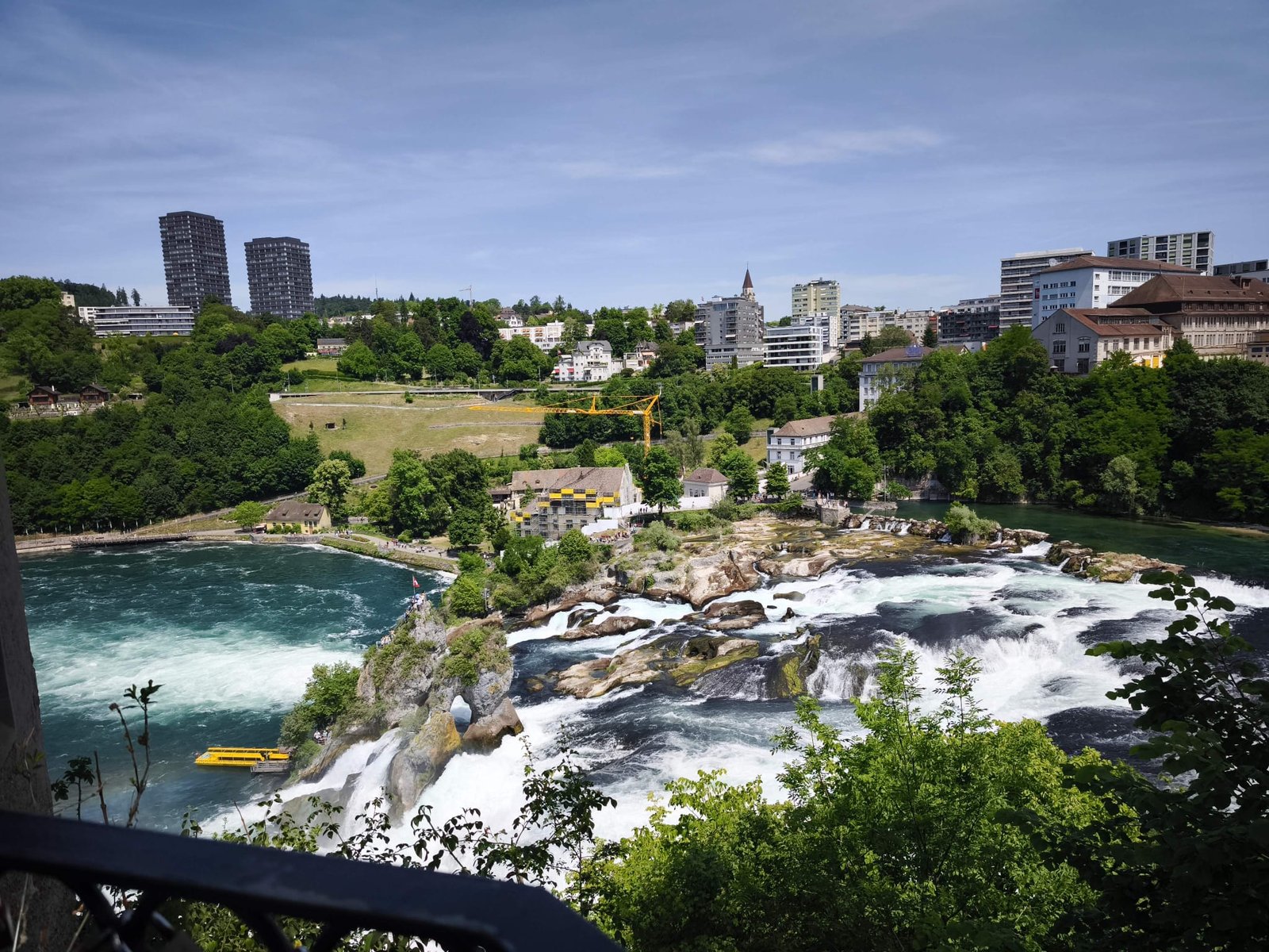 Panoramic view of the Rhine Falls cascade and rock island at Schaffhausen on a private day trip from Zürich